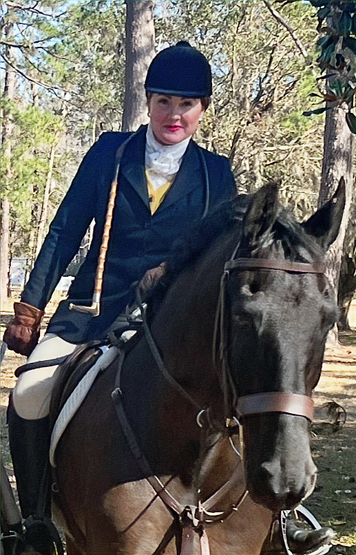 Original club Staff page photograph of a mounted hunt staff member.