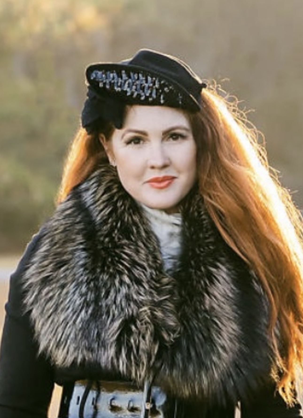 Portrait of Ashley McCalley wearing a hat outdoors