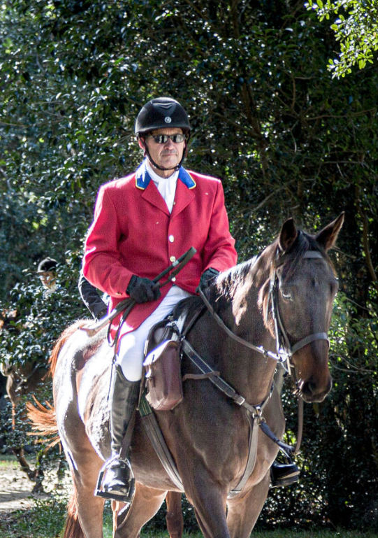 Bailey Bolen mounted in a scarlet coat on a dark horse