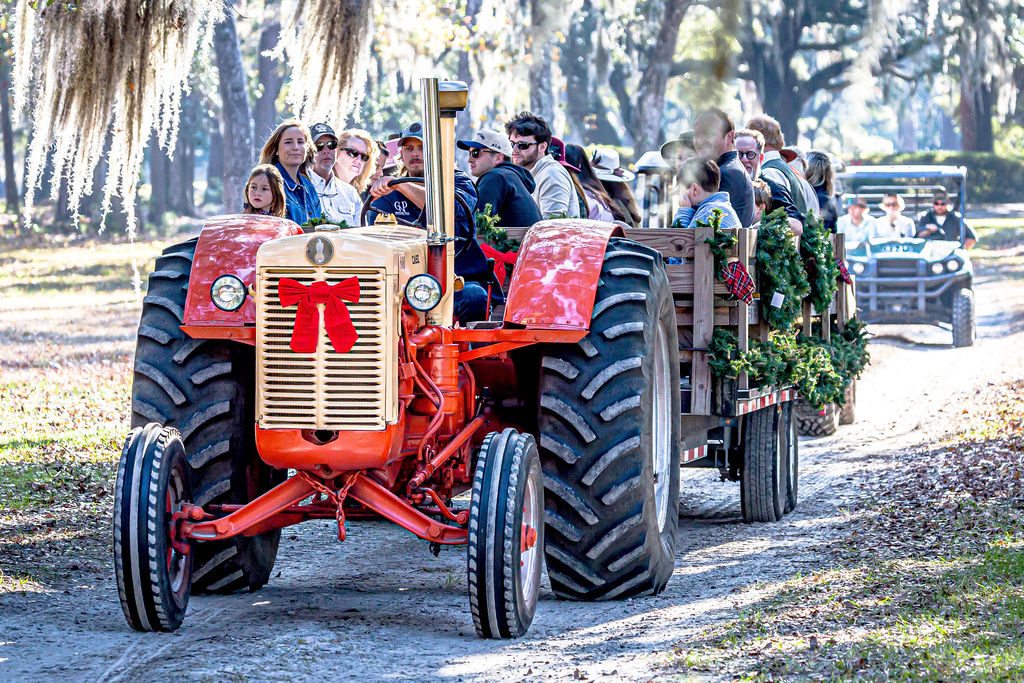 Club guests following the Hunt aboard the decorated Tally-Ho Wagon.