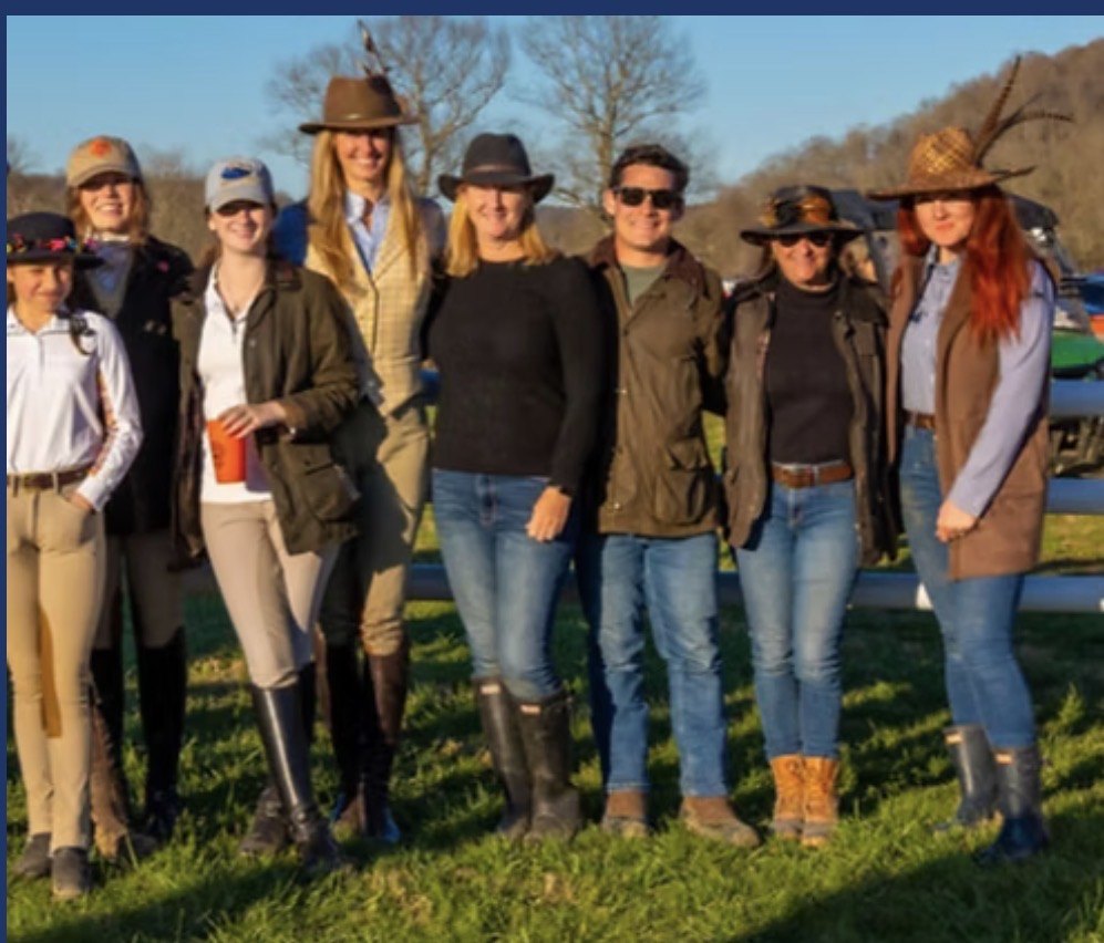 A group of club people standing together outdoors.